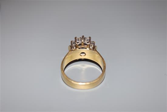 A modern 18ct gold, sapphire and diamond oval cluster ring, size M, gross 6.7 grams.